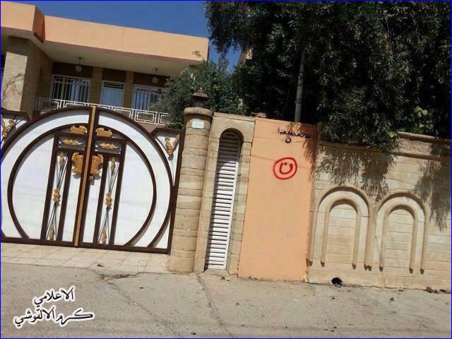 The Arabic letter "n" (inside red circle), signifying "Nasrani" (Christian), on an Assyrian home in Mosul.