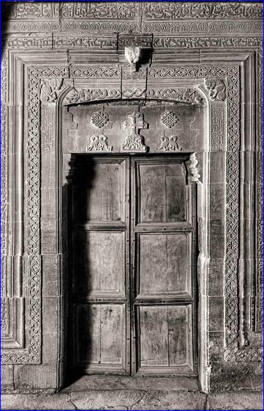 Mar Behnam (doorway) - Martyrion of Mar Behnam, c. 13th century. The Martyrion of M?r Behnam contains a trilingual inscription: Syriac, Arabic, and Uyghur (Old Turkic). Uyghur was used by the Mongols. This is the only known example of a Uyghur inscription in Iraq. It relates to a donation given to M?r Behnam by a Mongol Khan c. 1300 A.D. The monastery had been earlier ransacked by the Mongols; the donation was restitution. The b/w image was taken in the 1930's; the original was from a glass plate negative.