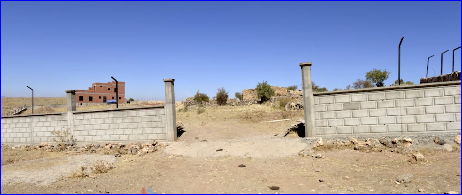 The illegal wall built by a Kurd.