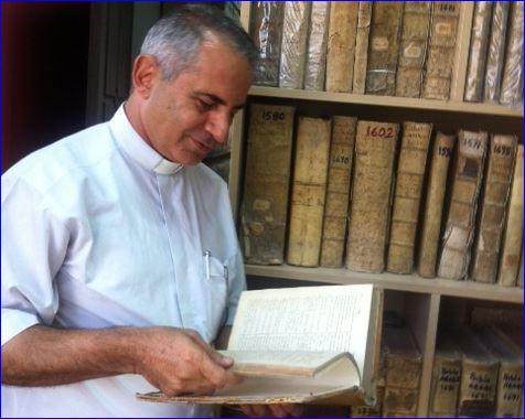 Father Nageeb in the safe house where he has stored a collection of ancient manuscripts. (photo: Sharmila Devi)