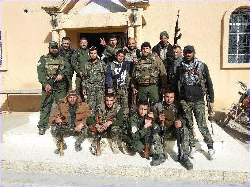 Assyiran fighters guard the church in Tel Hormizd, Syria, an Assyrian village that has been threatened by ISIS (AINA photo).