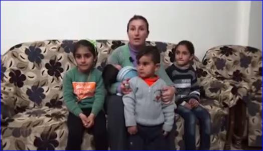 An Assyrian woman and her children who fled from Tel Tamar because of the attacks by ISIS.