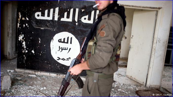 A Syriac Military Council soldier stands in a building recaptured from Islamic State forces. The rebel fighters lack the weaponry and resources to defeat IS permanently.