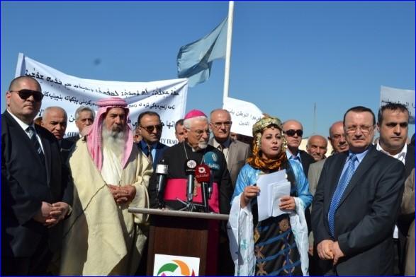 Assyrians, Yazidis and other non-Muslims demonstrate against the forced conversion law in front of the UN mission in Arbel, Iraq.