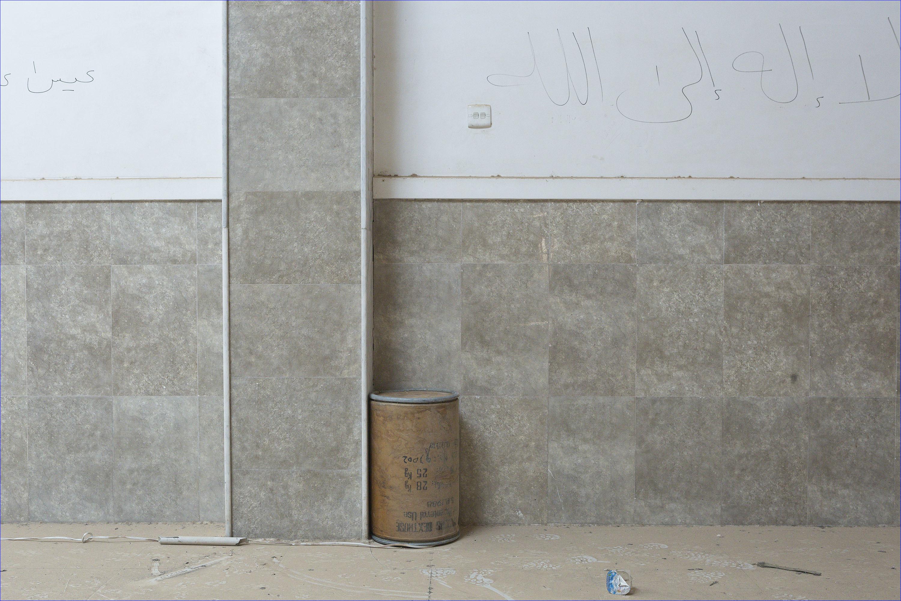 An improvised explosive device, which was set by Islamic State militants to destroy Saint Shmoni Church in Bartella, rests along a wall after being rendered safe by Iraqi Army engineers. Although ISIS militants were pushed back a large amount of improvised explosive devices are still being found in the town's buildings. ( Rex Features/AP)